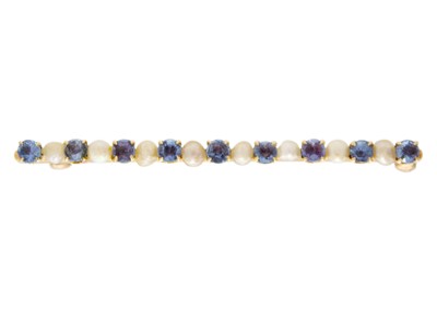 Lot 12 - A 14ct blue topaz and seed pearl set bar brooch.