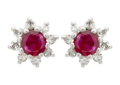 Lot 14 - A 14ct white gold ruby and diamond set cluster ring with matching stud earrings.
