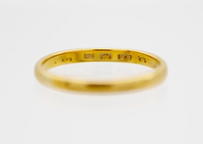 Lot 15 - A 22ct hallmarked gold band ring.