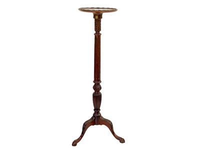 Lot 880 - An Edwardian mahogany torchere.