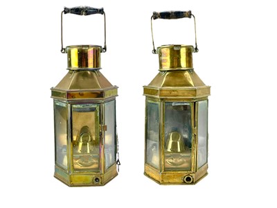 Lot 73 - A pair of brass bulkhead oil lamps by Bulpitt & Sons.