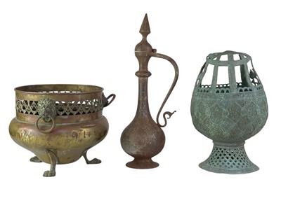 Lot 5 - A Persian damascened iron ewer.