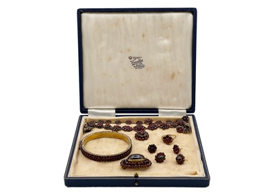 Lot 266 - A suite of Bohemian silver gilt garnet set jewellery.