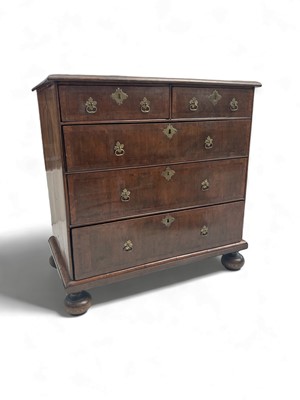 Lot 1295 - A walnut veneered chest