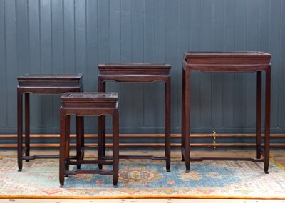 Lot 34 - A Chinese hardwood nest of four tables, early 20th century.