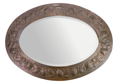 Lot 104 - A Newlyn oval copper framed wall mirror.