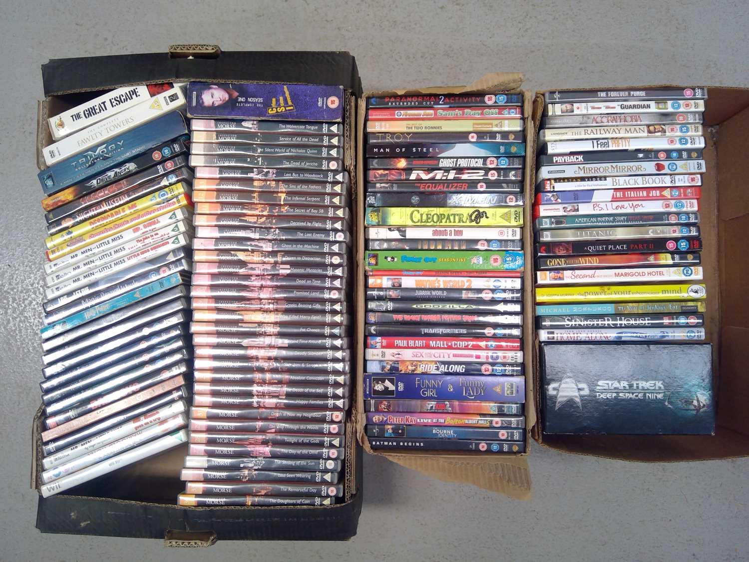 Lot 148 - Three boxes of over 100 DVDs. Including 33