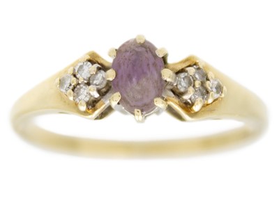 Lot 77 - A 9ct hallmarked gold diamond and amethyst set ring.