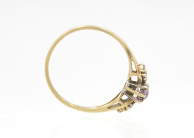 Lot 77 - A 9ct hallmarked gold diamond and amethyst set ring.