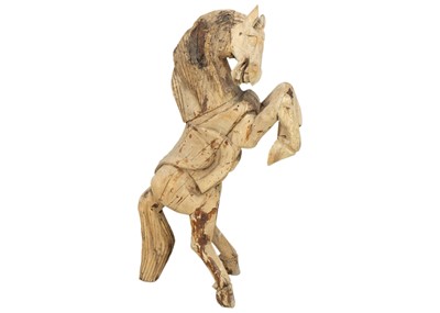 Lot 1109 - A carved hardwood standing figure of a rearing horse.