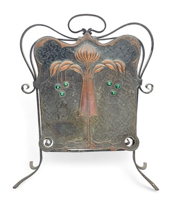 Lot 1356 - An Arts and Crafts wrought iron and copper fire screen.