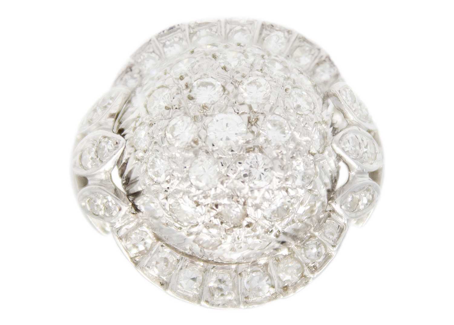 Lot 122 - A 14ct white gold diamond pavé set bombé ring.