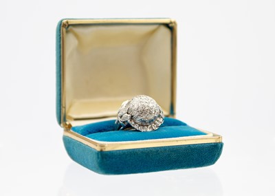 Lot 122 - A 14ct white gold diamond pavé set bombé ring.