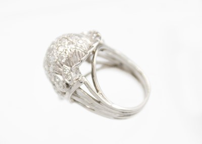 Lot 122 - A 14ct white gold diamond pavé set bombé ring.