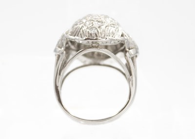 Lot 122 - A 14ct white gold diamond pavé set bombé ring.