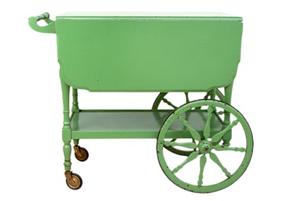 Lot 1673 - An Art Deco green painted drop leaf drinks trolley.