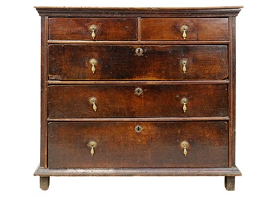 Lot 1066 - An 18th century oak chest of drawers.