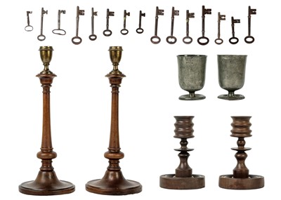 Lot 1081 - A pair of treen and brass candlesticks.