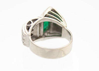 Lot 32 - A stylish Art Deco 18ct white gold emerald and diamond set dress ring.