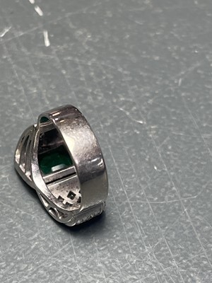 Lot 32 - A stylish Art Deco 18ct white gold emerald and diamond set dress ring.