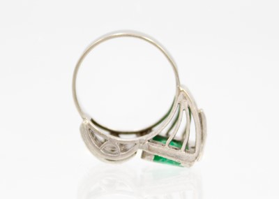 Lot 32 - A stylish Art Deco 18ct white gold emerald and diamond set dress ring.