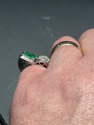 Lot 32 - A stylish Art Deco 18ct white gold emerald and diamond set dress ring.