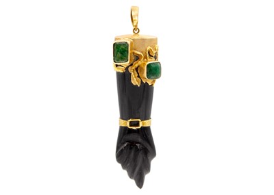 Lot 35 - A large rose gold-mounted onyx Figa hand charm set with emeralds.