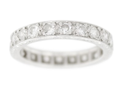 Lot 40 - An early 20th-century platinum diamond set full eternity ring.