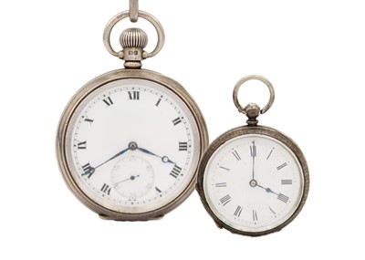 Lot 227 - A silver crown wind pocket watch with Albert watch chain, shield fob. and fob watch.