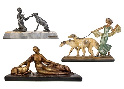 Lot 438 - An Art Deco spelter figure of a kneeling lady and greyhound.