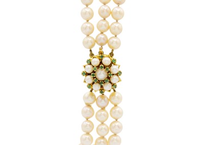 Lot 61 - A triple row cultured pearl bracelet with 9ct emerald and pearl set cluster clasp.