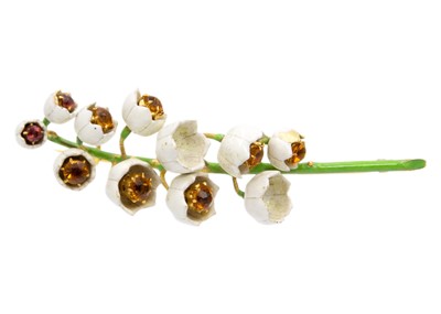 Lot 73 - An unusual high-purity gold and enamel lily of the valley design brooch set with citrine.