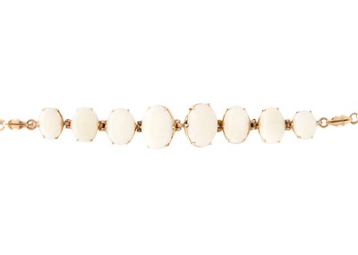 Lot 75 - A rose gold white opal set bracelet.