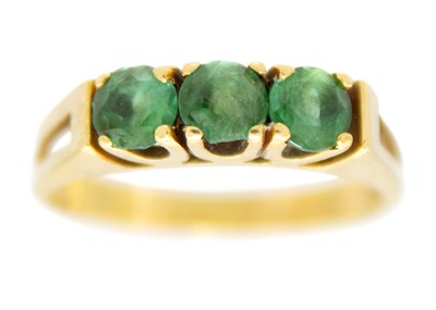 Lot 97 - An 18ct three-stone emerald ring.