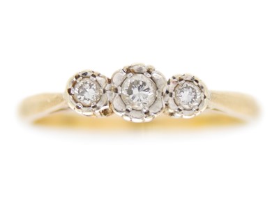 Lot 252 - A 9ct hallmarked gold diamond set three-stone ring.