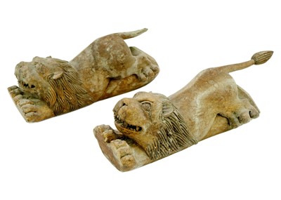 Lot 1242 - A pair of carved lions.