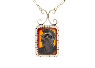 Lot 94 - A carved sardonyx cameo pendant necklace set in yellow and white gold.