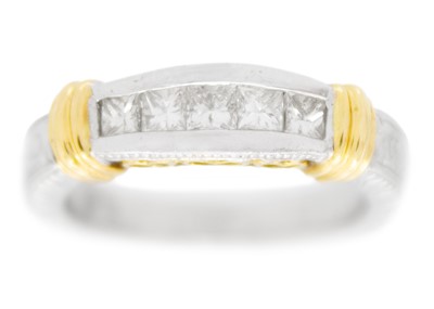 Lot 104 - A modern 18ct white and yellow gold ring set with five graduated princess cut diamonds.