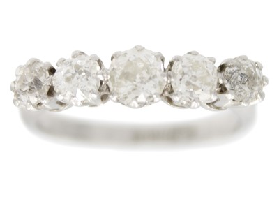 Lot 113 - A platinum five-stone old cut diamond set ring.