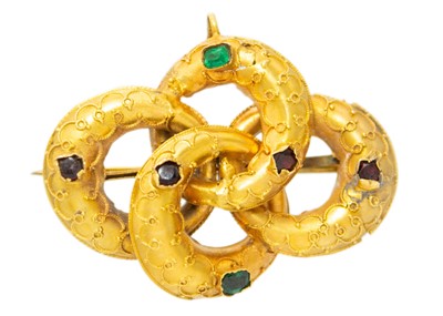 Lot 115 - A Victorian gold gem set lover's knot brooch.