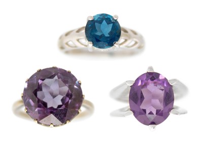 Lot 123 - Three gem-set dress rings.