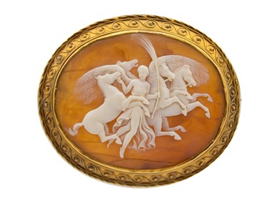 Lot 135 - A Victorian Etruscan Revival high-purity gold (tests 18ct approx.) framed shell cameo brooch.