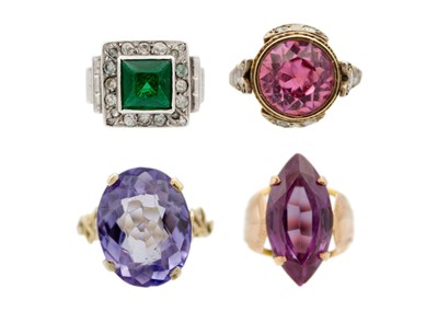 Lot 138 - A selection of four gem set dress rings, mounted in gold.