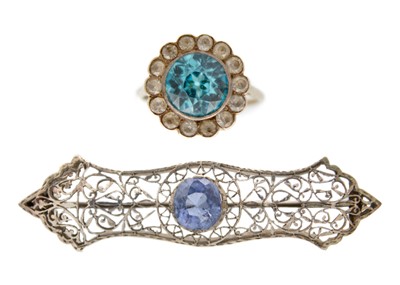 Lot 148 - An Edwardian finely worked white metal brooch set with a Ceylon sapphire.