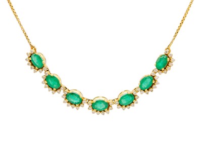 Lot 162 - An attractive 18ct emerald and diamond cluster set necklace.