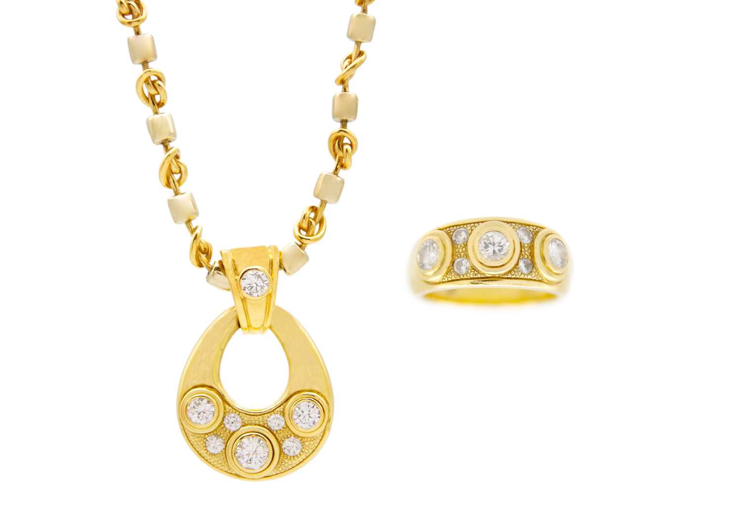 Lot 54 - A modern 18ct heavy gold diamond set pendant necklace and matching ring.