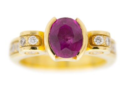 Lot 164 - A modern heavy 18ct diamond and pink stone, possibly almandine garnet, set dress ring.