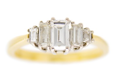 Lot 174 - An 18ct (tested) diamond set five stone ring.