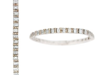 Lot 118 - An Art Deco style silver articulated bracelet set with aquamarines and diamonds.