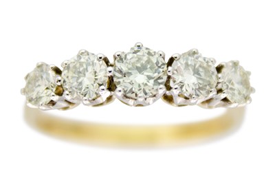 Lot 119 - An attractive 18ct (tested) yellow and white gold diamond set five-stone ring.